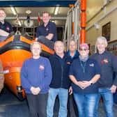 Bill Wraith is pictured with Flamborough RNLI crew and station officials. Photo by Rod Newton.