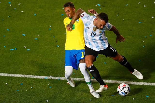 STRAY ELBOW: Raphinha is caught by Nicolas Otamendi. Picture: Getty Images.