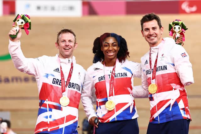 Great Britain's mixed cycling sprint team of Jody Cundy, Leeds' Kadeena Cox and Jaco van Gass receive their gold medals at the Tokyo 2020 Paralympics. Picture: Picture: Alex Whitehead/SWpix.com.