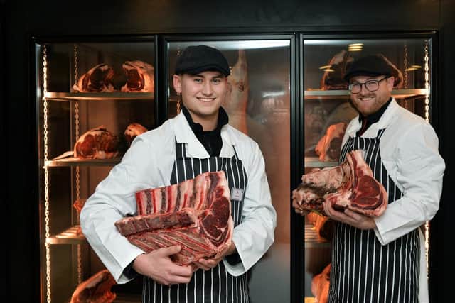 Pictured at the Robertshaw’s butcher’s counter are Harley Robertshaw, left, and  Jack Holden.