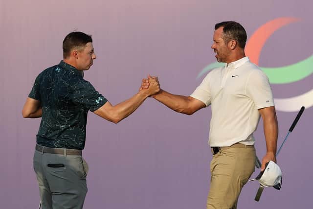 Paul Casey of England (R), shakes hands with Matthew Fitzpatrick of England at the 18th hole during Day One of The DP World Tour Championship at Jumeirah Golf Estates on November 18, 2021 in Dubai, United Arab Emirates. (Picture: Warren Little/Getty Images)