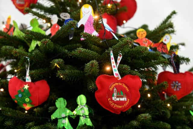 The decorative hearts on the Baldersby St James Primary School Christmas Tree from near Thirsk representing each of the pupils in the small school at the York Minster Christmas Tree Festival. Writer: Byline: Gary Longbottom