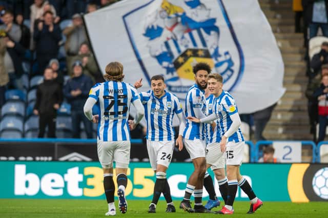 Huddersfield Town players celebrate Danel Sinani's goal against West Brom. Picture: Tony Johnson.