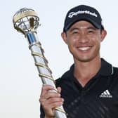 Winner: Collin Morikawa of with The DP World Tour Championship trophy after winning The DP World Tour Championship and The Race to Dubai. (Photo by Luke Walker/Getty Images)