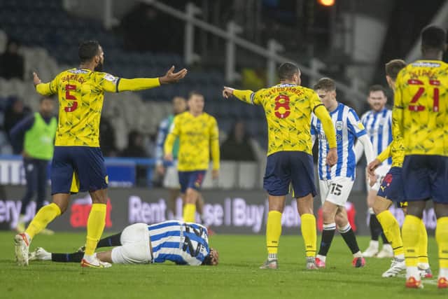West Bromwich captain Jake Livermore protests his innocence aftter his high challenge on Terriers Fraizer Campbell, but recieved a red card. (Picture: Tony Johnson)