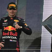 Holding on: Red Bull driver Max Verstappen finished second in Qatar and is eight points ahead of rival Lewis Hamilton in the title race. (AP Photo/Darko Bandic)