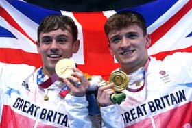 Great Britain's Tom Daley (left) and Matty Lee celebrate winning gold in the Men's Synchronised 10m Platform Final at the Tokyo Aquatics Centre on the third day of the Tokyo 2020 Olympic Games in Japan.