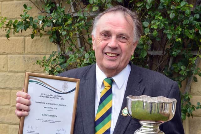 Geoff with his award.