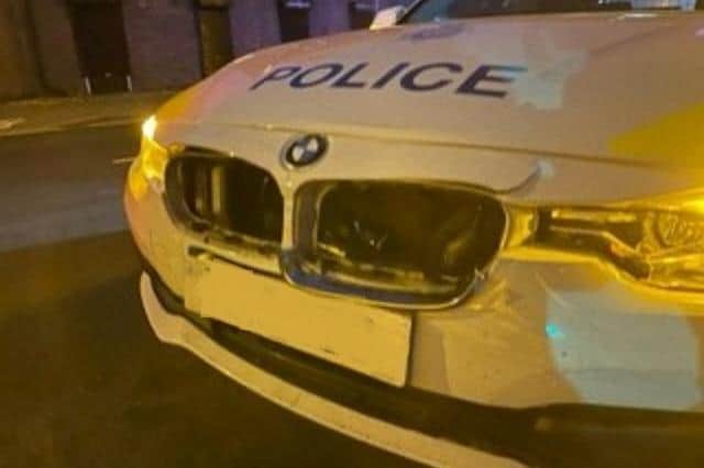 The damage done to the police car