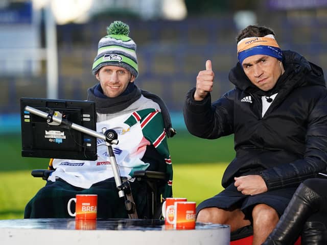 Kevin Sinfield, with Rob Burrow (left), is interviewed at Headingley Stadum after completing the Extra Mile Challenge from Leicester to Leeds.