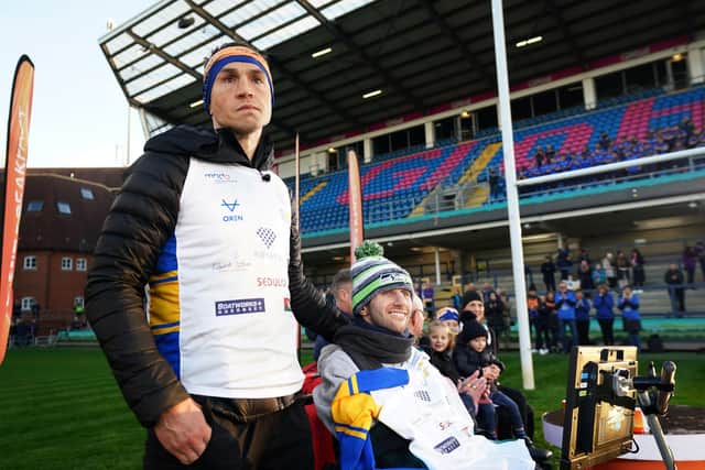 Kevin Sinfield, with Rob Burrow, at Headingley Stadum after completing the Extra Mile Challenge from Leicester to Leeds.