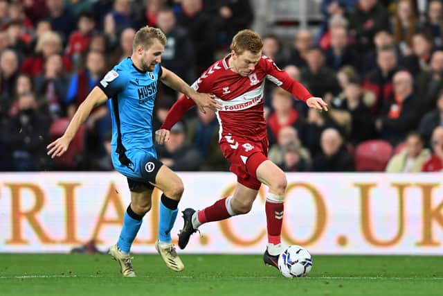 Duncan Watmore is chased by Billy Mitchell.
 (Picture: Bruce Rollinson)