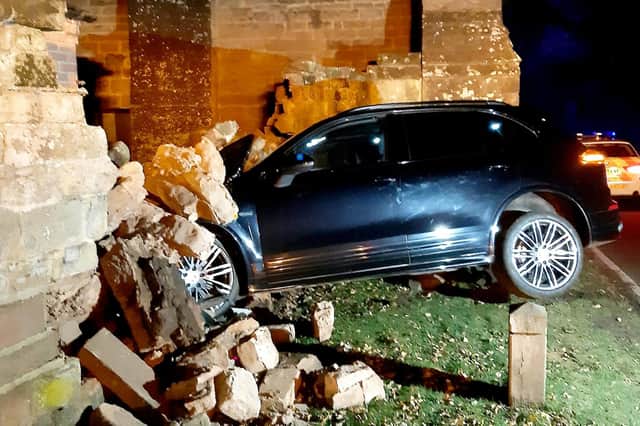 Police dashed to the scene after the Cayenne demolished part of a wall