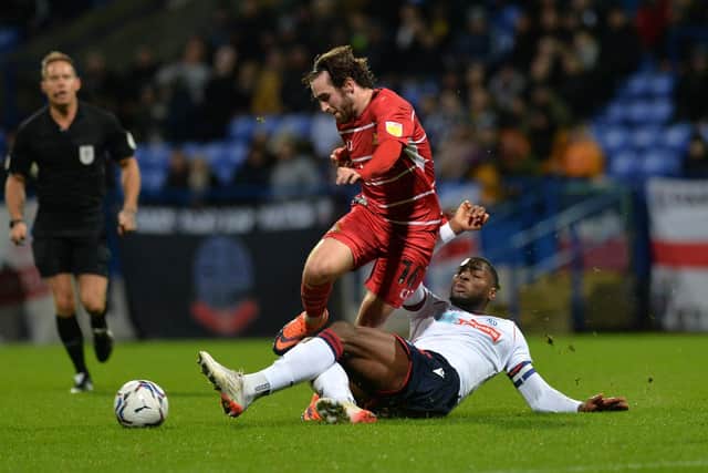 Doncaster's Aidan Barlow is tackled by Bolton's Ricardo Almeida Santos.(Picture: Jonathan Gawthorpe)