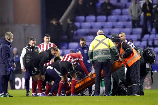 Sheffield United's John Fleck is placed on a stretcher during the Sky Bet Championship match at the Madejski Stadium, Reading. (Picture: PA)