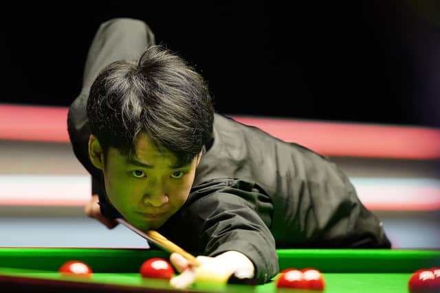 COMETH THE HOUR, COMETH THE AMATEUR: Si Jiahui, pictured during his first round match against Shaun Murphy in the UK Championship at the York Barbican. Picture: Mike Egerton/PA