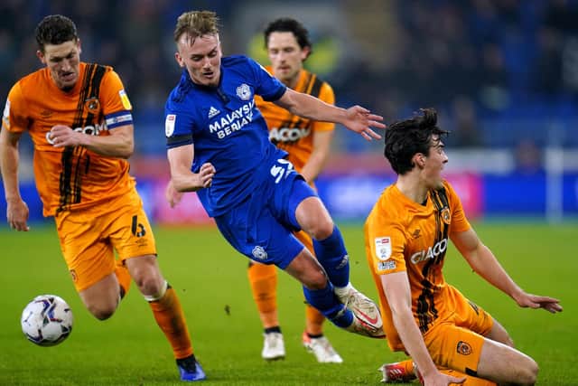 Cardiff City's Isaak Davies (centre) battles for the ball with Hull City's Jacob Greaves (right) and Richard Smallwood (Picture: PA)