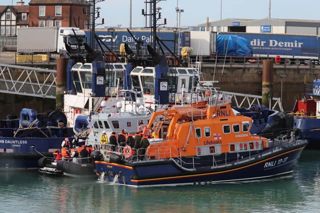 Border Force officers bring ashore a group of peoplefrom the RNLB Fraser Flyer in Dover, Kent, in September 7, 2020. Picture: Gareth Fuller/PA Wire.