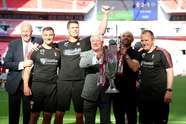 But plenty of highs: Rotherham United manager Paul Warne (second right) and chairman Tony Stewart (centre right) celebrate with the trophy and first team/development coach Matt Hamshaw (right), goalkeeping coach Mike Pollitt (centre left) and assistant manager Richie Barker (second left) after the Sky Bet League One Final at Wembley Stadium, London. (Picture: Nigel French/PA Wire)