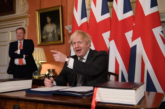 Brexit Minister David frost (left) with Boris Johnson as the Brexit deal was signed last December.