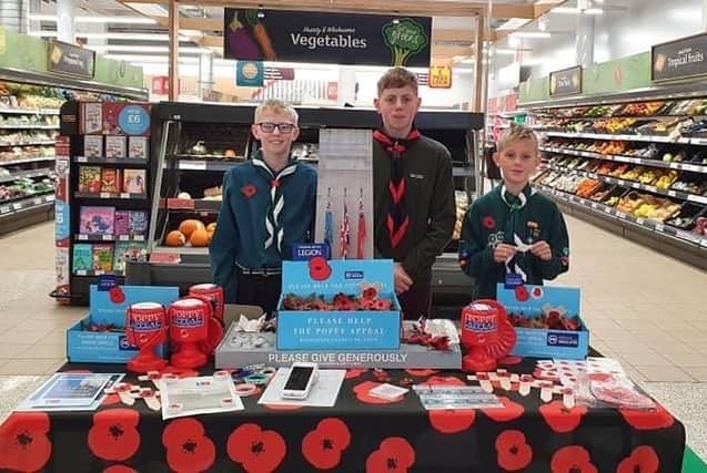 Scouts are pictured at the Sainsbury’s store. The shop stall brought in more than £9,000 for the Poppy Appeal.