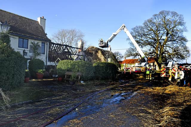 The middle section of the thatched roof has been destroyed