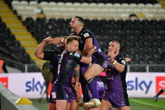 GREAT VIEWING: Leeds Rhinos players mob Brad Dwyer as he celebrates scoring his side's first try against Hull FC in July. 
Picture : Jonathan Gawthorpe