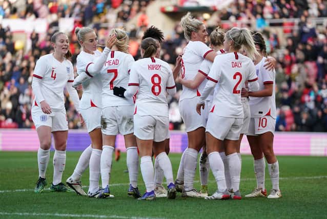 On their way: England's Ellen White, centre right, celebrates with her team-mates after scoring.