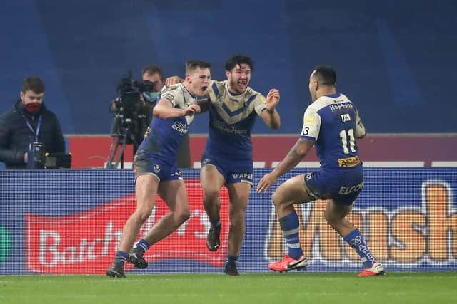 DRAMA: St Helens Jack Welsby, left, celebrates scoring the winning try during the Betfred Super League Grand Final at the KCOM Stadium. Picture: Martin Rickett/PA