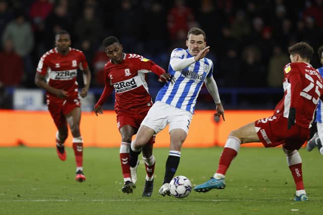 Closed down: Isaiah Jones  of Middlesborough challenges Harry Toffolo of Huddersfield Town. (Photo by John Early/Getty Images)