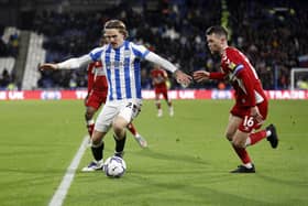 Second best: Danny Ward of Huddersfield Town is challenged by Jonny Howson of Middlesborough during the visitors' 2-1 win.  (Photo by William Early/Getty Images)