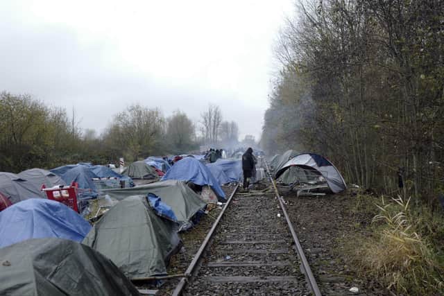 A migrants makeshift camp is set up in Calais, northern France, on Saturday, November 27.