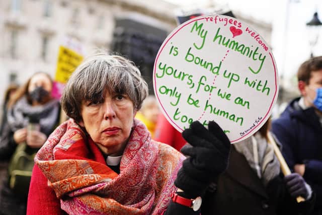 People take part in a protest outside Downing Street in Westminster, London, calling on the Government to scrap the Nationalities and Borders bill and for the rapid expansion of safe and legal routes for refugees to enter Britain and claim asylum.
