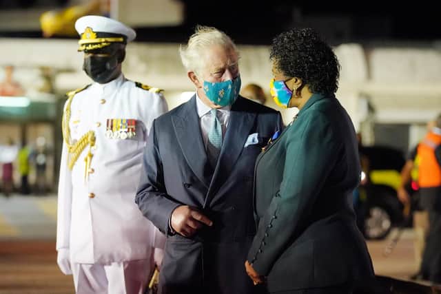 The Prince of Wales chats with Sandra Mason, the former Governor General and President Elect of Barbados, upon his arrival at Grantley Adams International Airport, Bridgetown, Barbados.