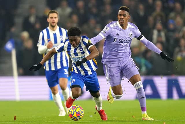 Brighton and Hove Albion's Tariq Lamptey (left) and Leeds United's Junior Firpo battle for the ball at the AMEX Stadium. Picture: Adam Davy/PA