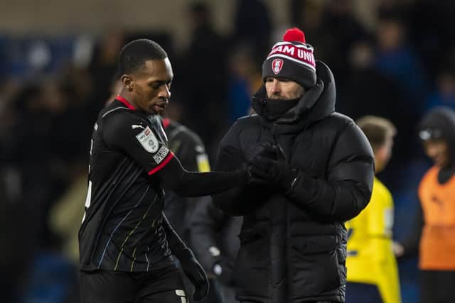 Rotherham United's Mickel Miller and manager Paul Warne chat after the final whistle of their clash with Oxford at the Kassam Stadium on Saturday. Picture: Leila Coker/PA