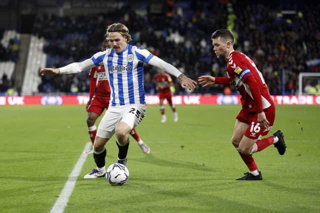 Middlesbrough's Jonny Howson challenges Huddersfield Town's Danny Ward at Kirklees Stadium Picture: William Early/Getty Images