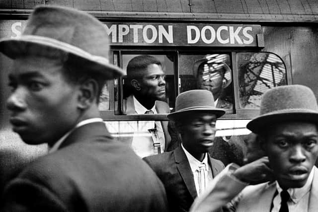 Howard Grey's images of Windrush migrants arriving at Waterloo Station.