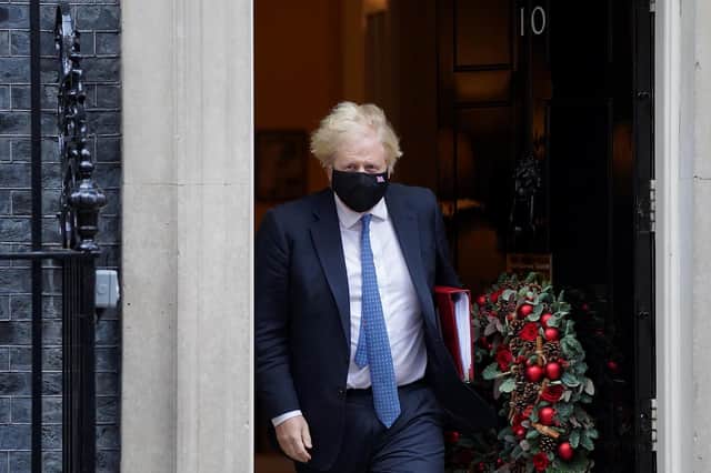 Prime Minister Boris Johnson leaves 10 Downing Street, London, to attend Prime Minister's Questions at the Houses of Parliament. (PA)