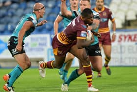 Huddersfield’s Jermaine McGillvary crosses for one of his 14 tries for the Giants last season, but is excited ahead of the new Super League campaign in 2022. Picture: Jonathan Gawthorpe