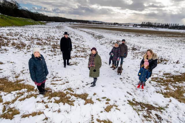 A group of objectors on the site (left to right) Councillor Julie Abraham, GP Dr Robert Mitchell, Councillor Vanessa Walker, residents Julie and Stewart Bentley with their dog Alfie, and Sam Quelch, with daughter Fearne Collingwood Picture: James Hardisty
