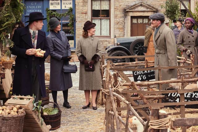 Darrowby market square: Left: Tristan Farnon (Callum Woodhouse) Middle Left: Mrs Hall (Anna Madeley) Middle Right: Diana Brompton (Dorothy Atkinson) Right: Gerald Hammond (Will Thorp)