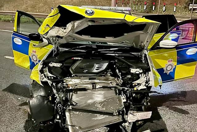 The police car was left mangled after being rammed