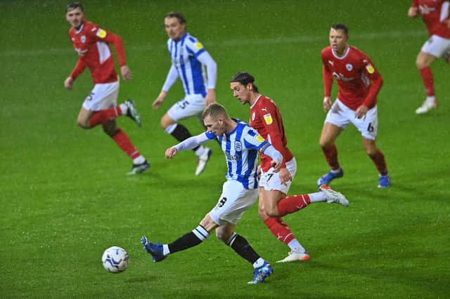 Lewis O'Brien puts Huddersfield Town in front against Barnsley at Oakwell. Picture: Bruce Rollinson.