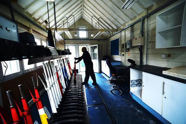 Pictured Chris Dale a member of the signal box steering community inside the signal box. Picture : Jonathan Gawthorpe