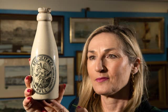 Caroline Hawley of Hawleys Auctioneers with a Geo Jeff&co , Victorian. Ginger beer bottle lot 862, £500-800, part of this weekends Auction at Beverley Race Course. Picture Bruce Rollison