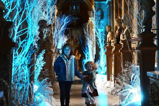Two children explore a Christmas display at Castle Howard, near York. (Jonathan Gawthorpe).