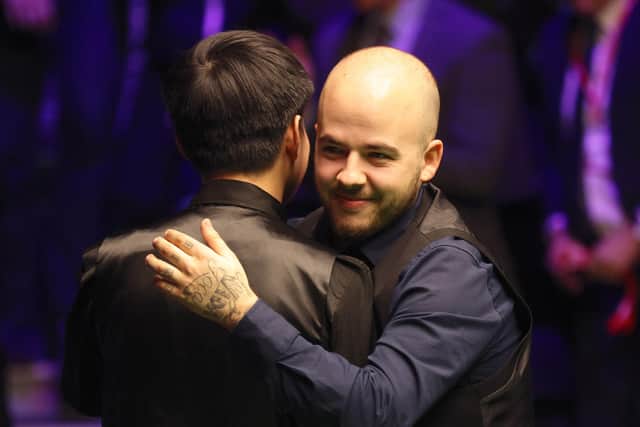Zhao Xintong embraces Luca Brecel after the Cazoo UK Championship final.