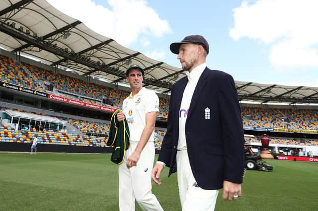 Friendly foes: Australia's Pat Cummins  and England's Joe Root during the Ashes Series Launch at The Gabba in Brisbane, Australia. Pictures: Jason O'Brien/PA