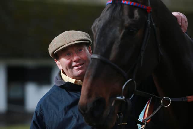 Spritner sacre with Nicky Henderson at the trainer's Seven Barrow stables.